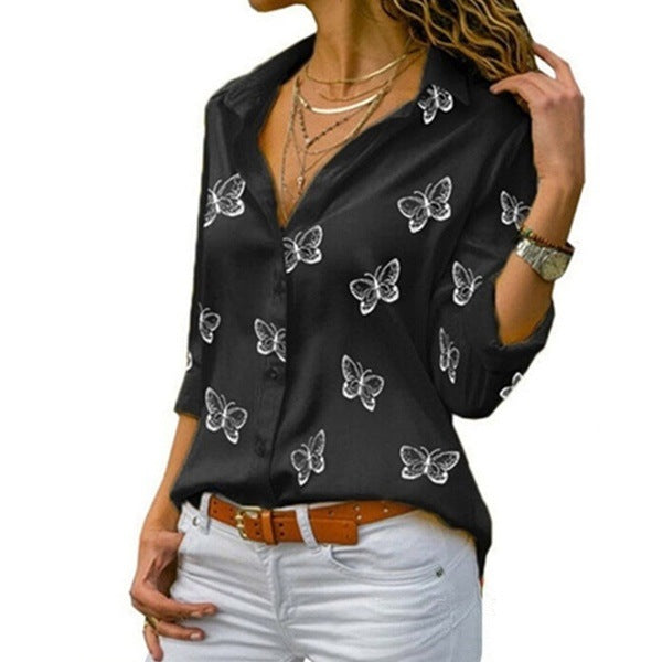 Neleia – Loose blouse with butterfly pattern