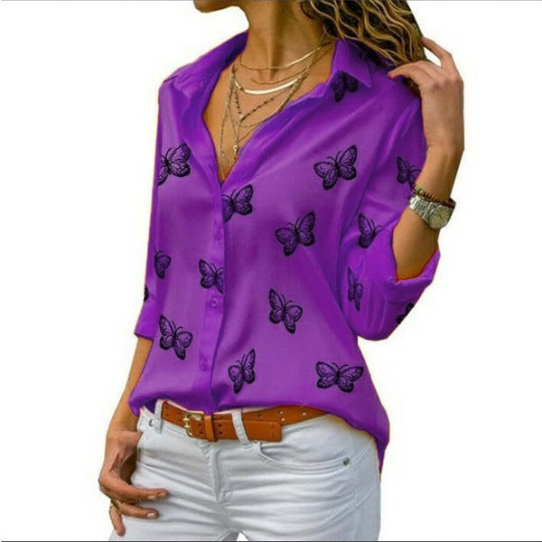 Neleia – Loose blouse with butterfly pattern