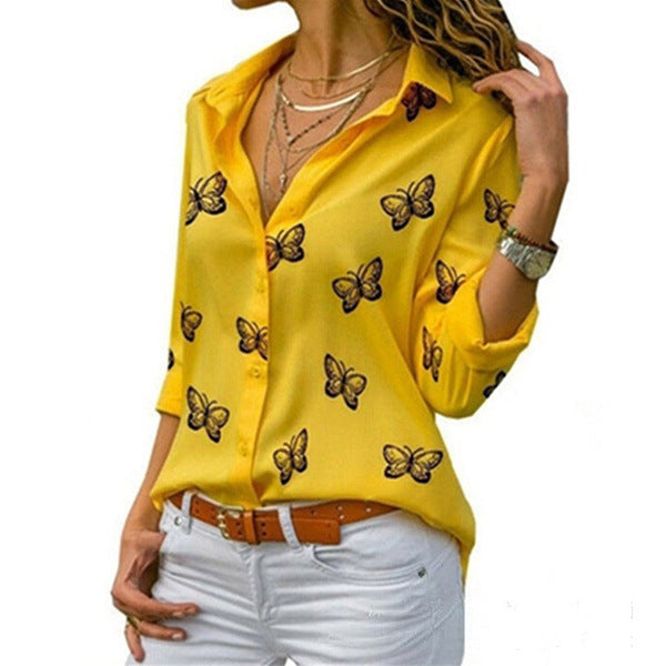 Neleia – Loose blouse with butterfly pattern