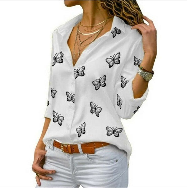 Neleia – Loose blouse with butterfly pattern