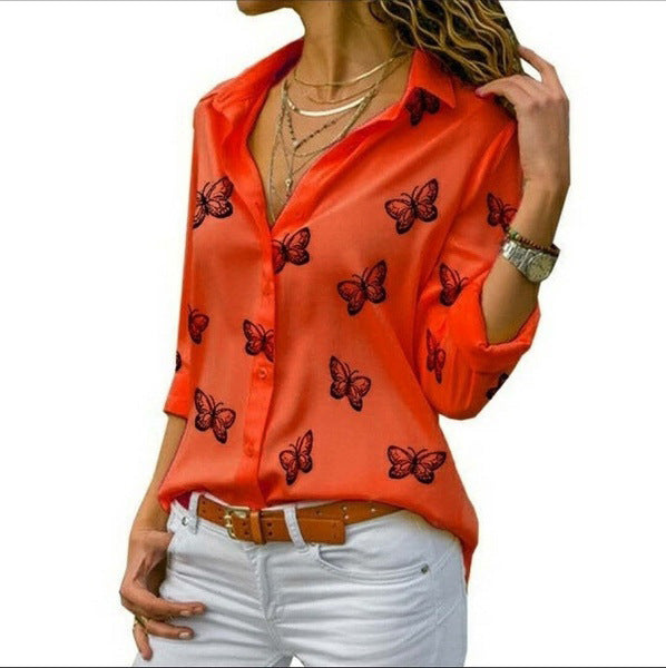 Neleia – Loose blouse with butterfly pattern