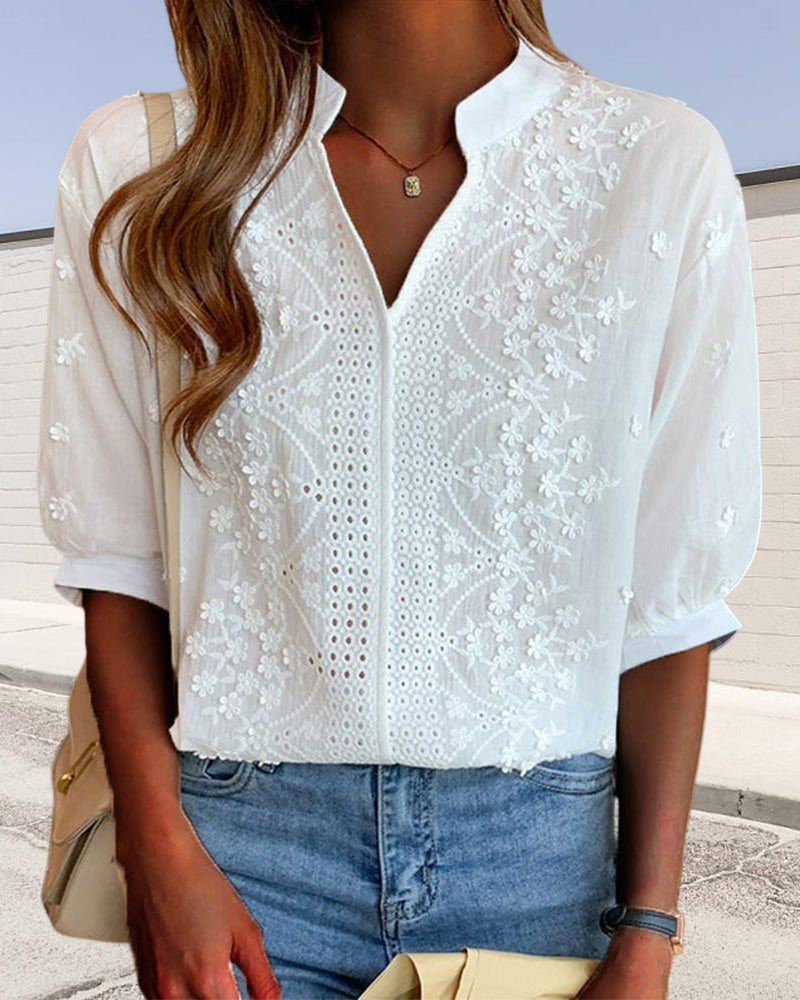 V-neck blouse with puff sleeves and lace details