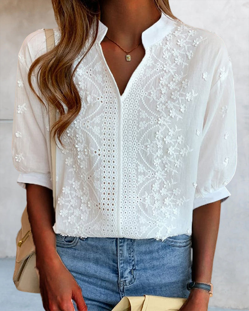 V-neck blouse with puff sleeves and lace details